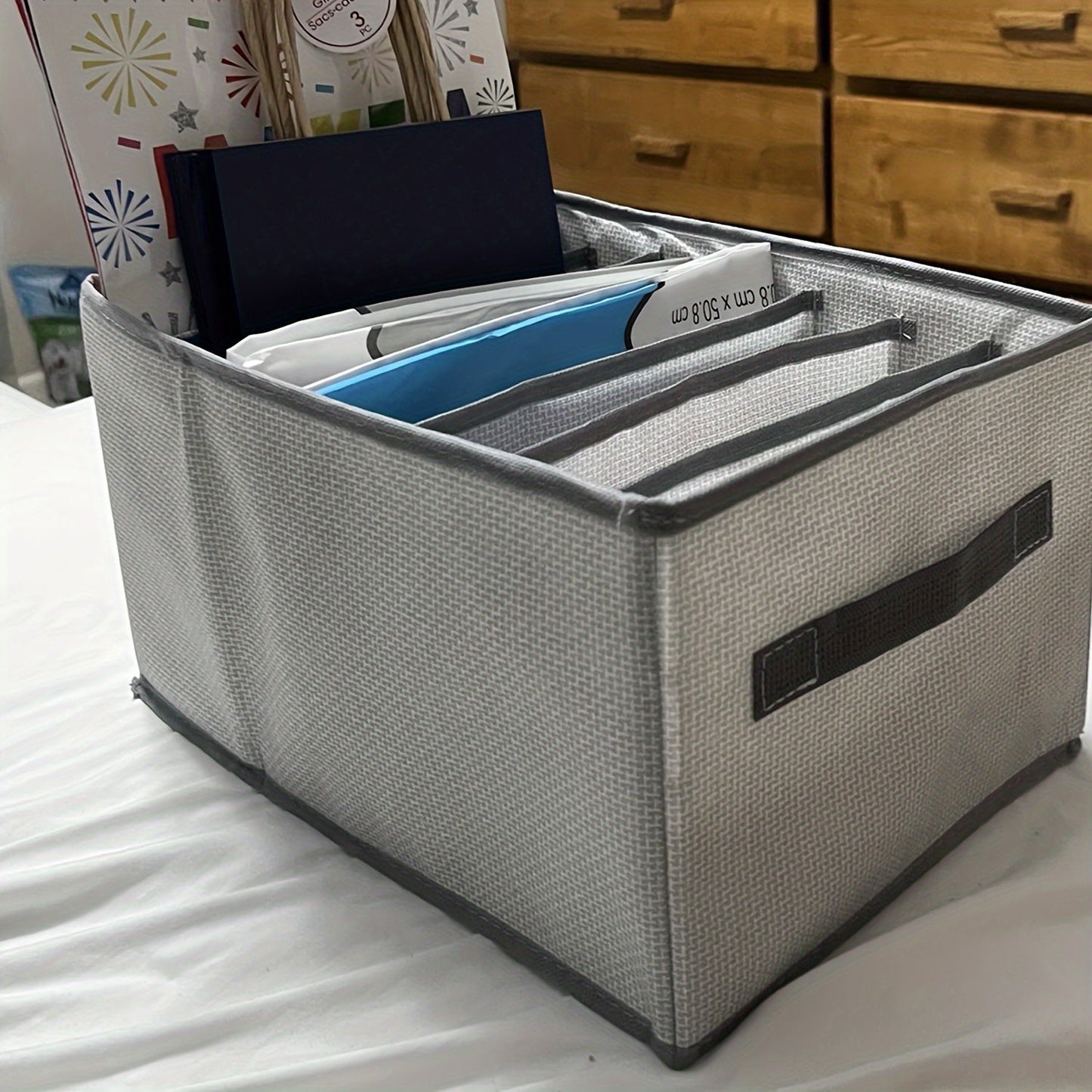 Fabric under-bed storage containers for contemporary use - versatile organizers for winter clothing and essentials that are not waterproof.