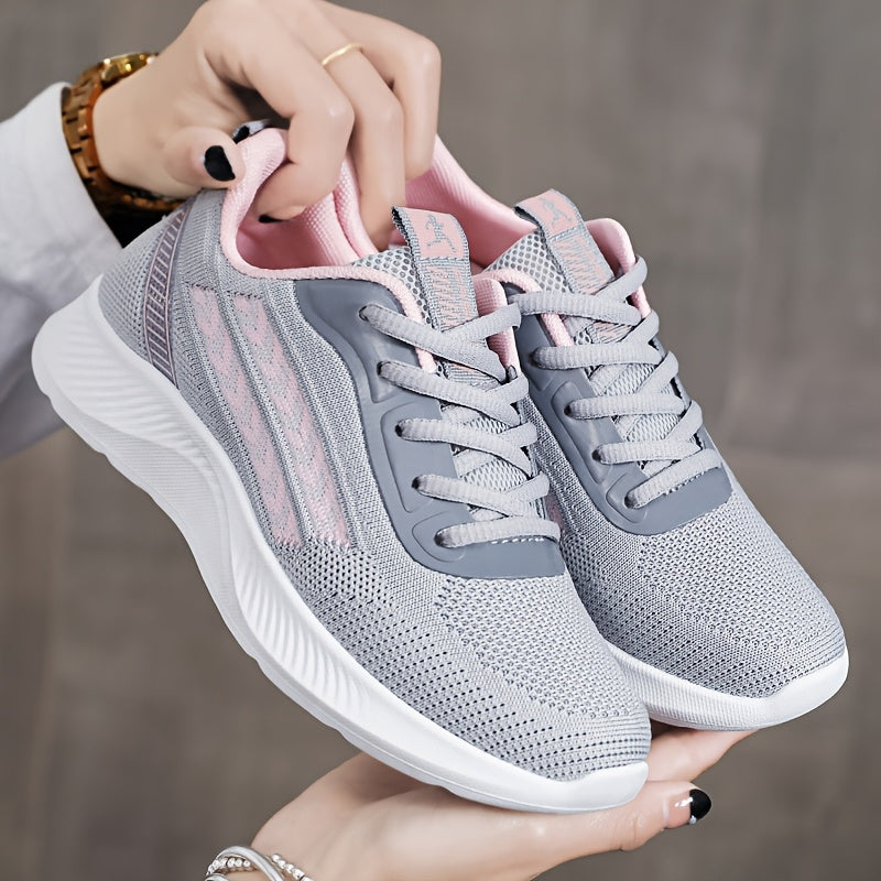 Breathable mesh running shoes for women with lightweight design, lace-up closure, fabric upper, and PU sole.