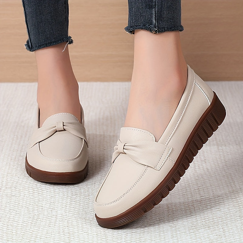 Women's comfortable penny loafers with bow embellishment, non-slip sole, round toe, all-season footwear, man-made materials, TPR sole.