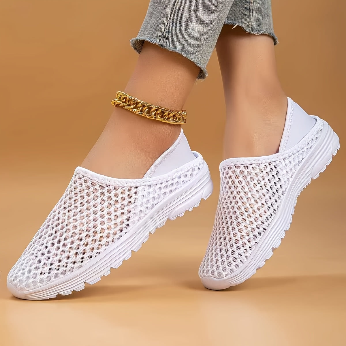 Mesh slip-on walking shoes with stability support, lightweight white summer footwear.