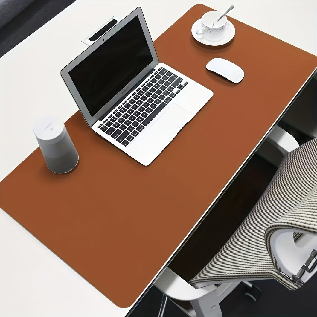 Waterproof faux leather desk pad with anti-slip surface for office and home use. Measures 59.99 x 32.99 cm. Rectangular mouse pad for workspace protection. Sleek and easy to clean design.