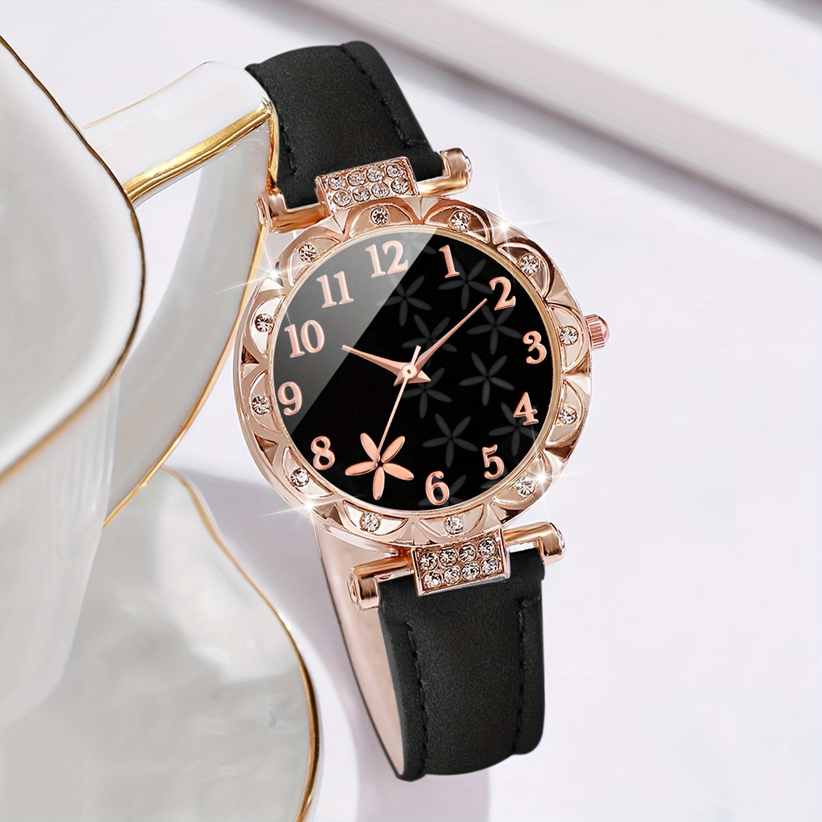 Set includes a women's fashion watch with bracelet. Features digital quartz movement, round alloy case, PU leather strap, and non-rechargeable battery. Watch box not included.