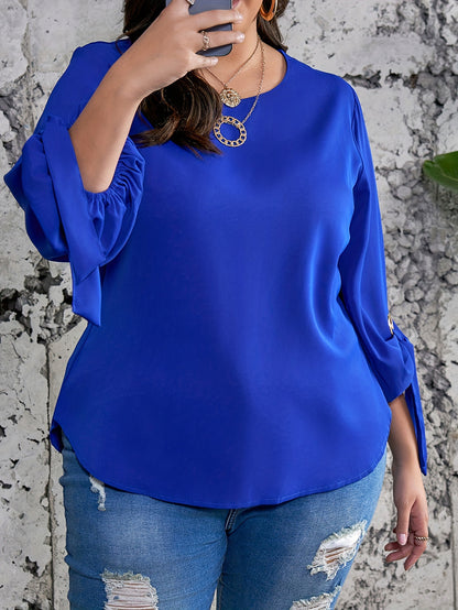 Elegant plus size royal blue satin blouse with tie sleeves, round neck, and smooth texture. Perfect for spring, summer, and fall.