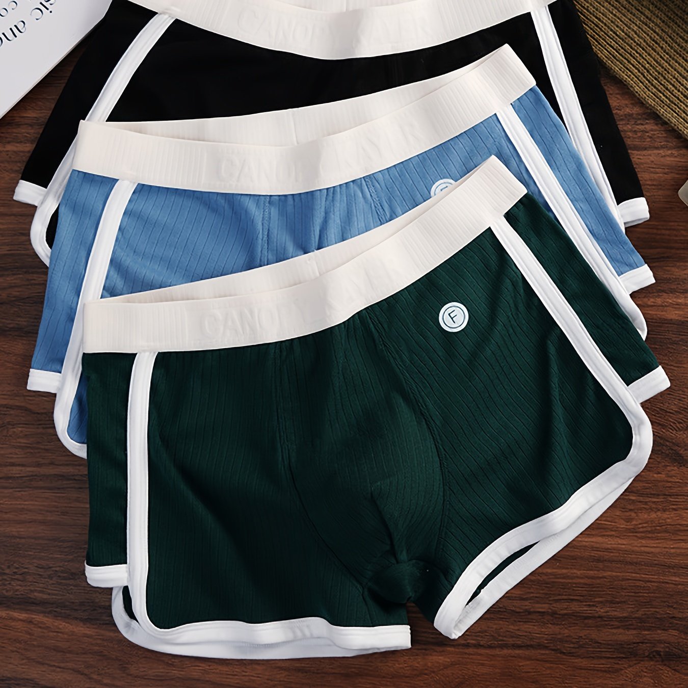 3 Men's Striped Boxer Briefs made of comfy polyester blend with elastic waistband and stylish color block design