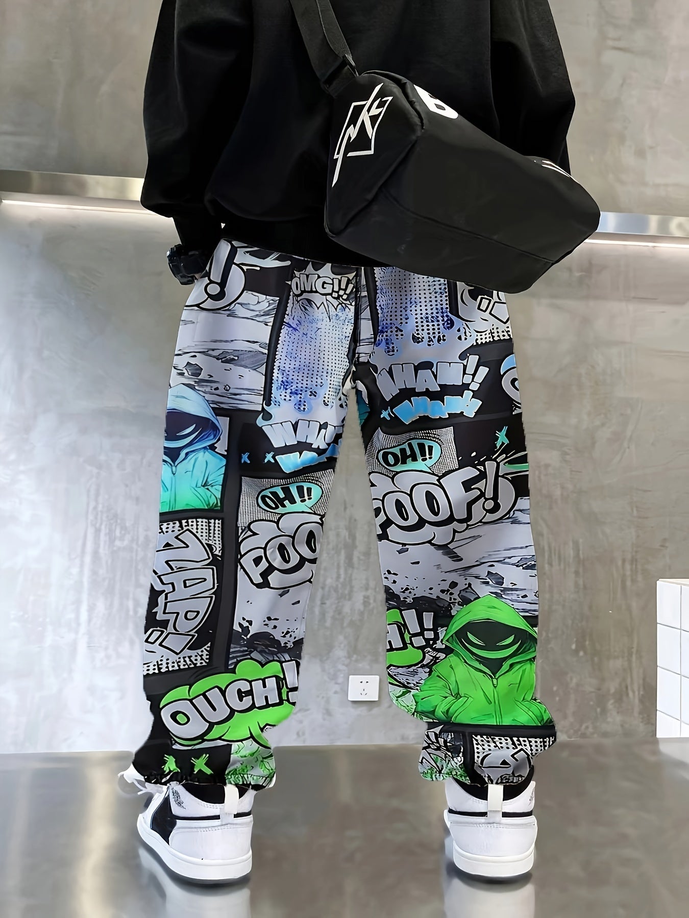 Comfy boys joggers with graffiti and ink splashes, elastic waist.