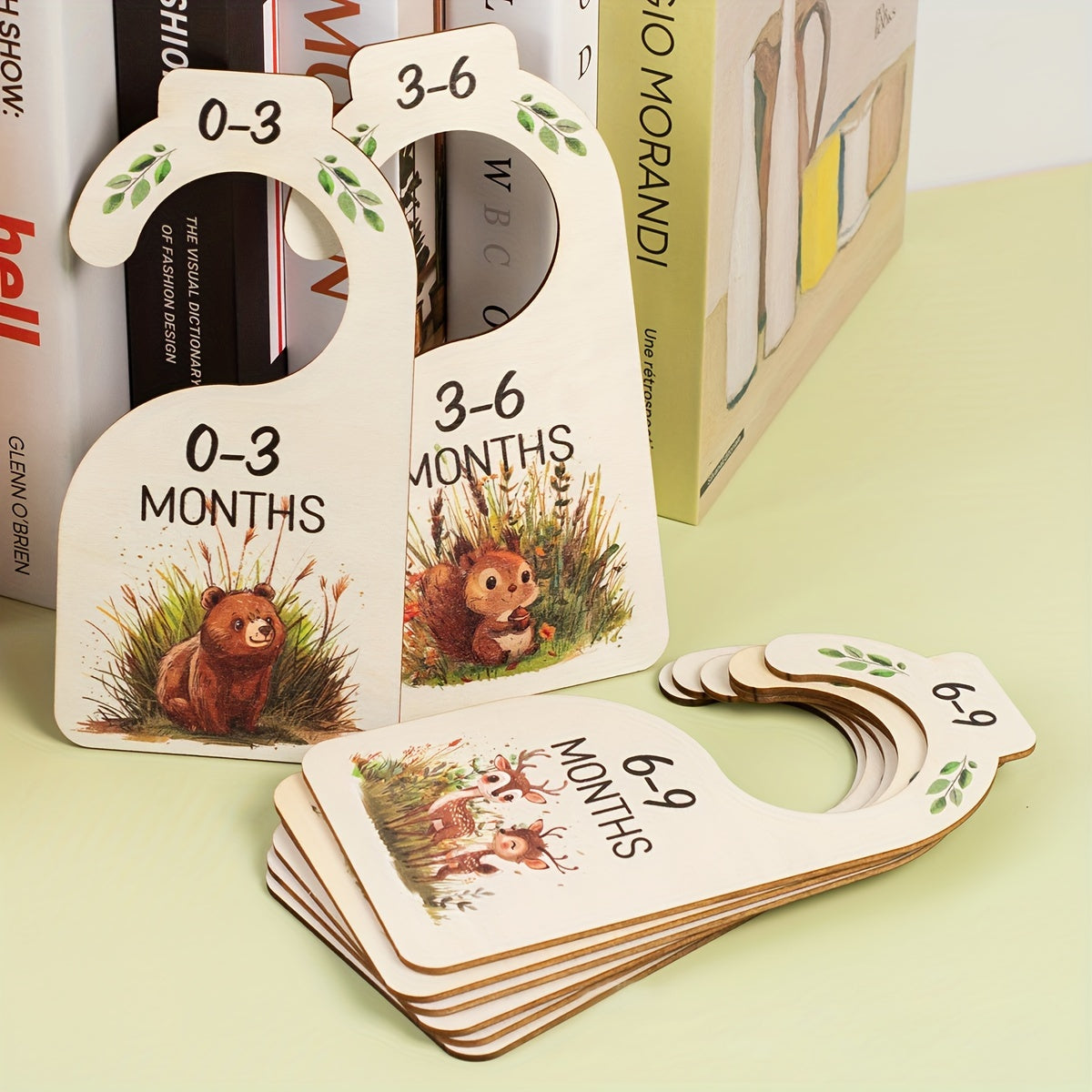 8 wooden closet dividers featuring cute animal themes for organizing clothes in a wardrobe for 24 months.