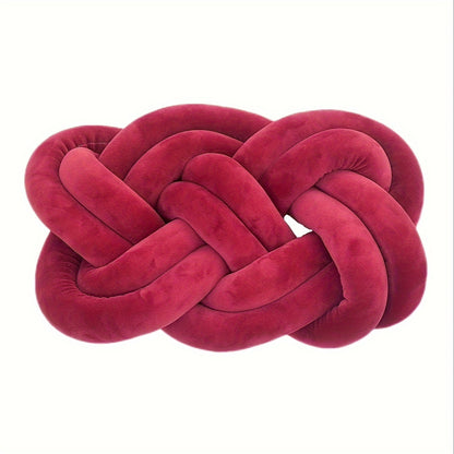 Knotted throw pillow for home decor, suitable for bed or sofa.