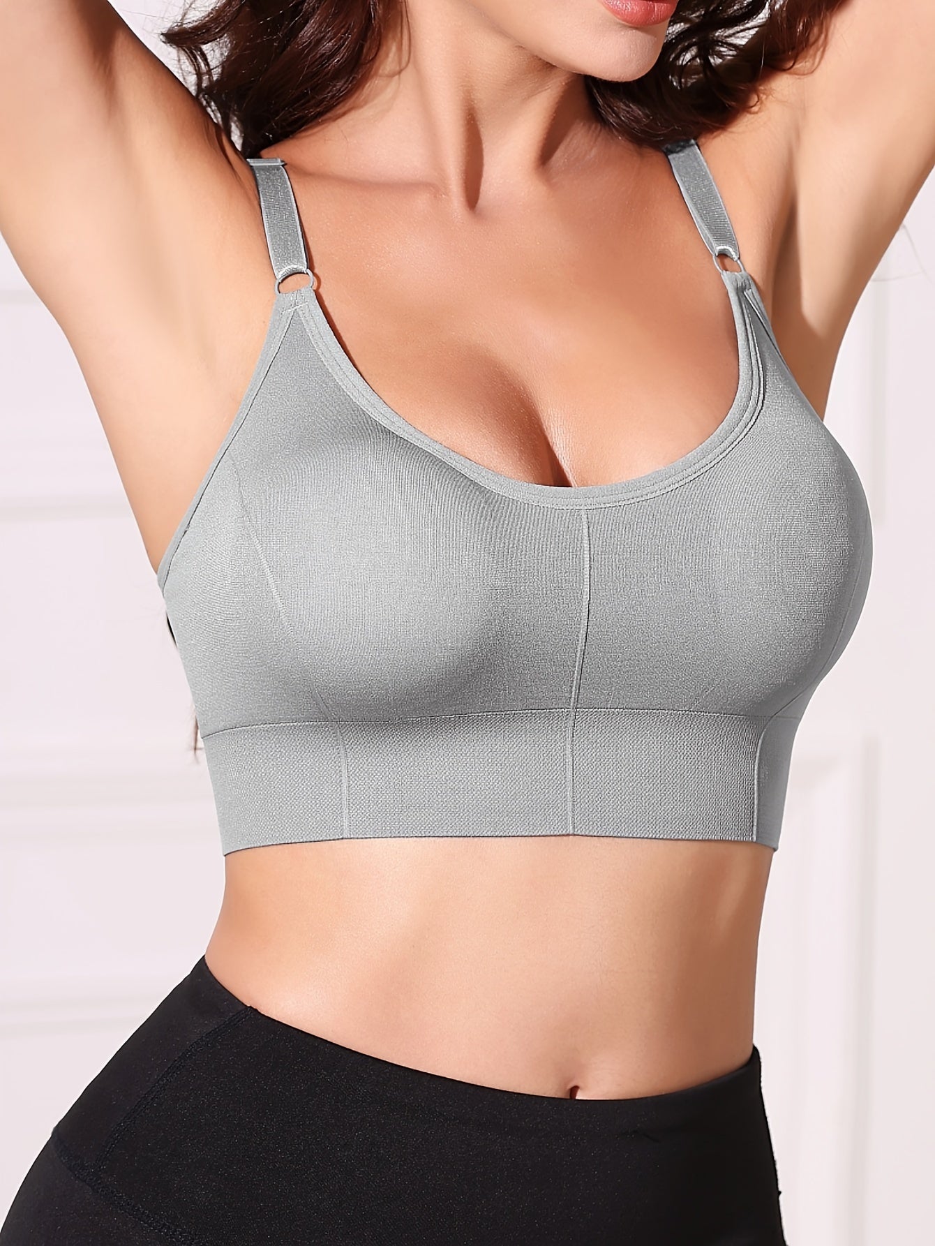 Gray wireless women's bra with removable pads, comfortable nylon blend, adjustable straps, backless design, and breathable fabric.