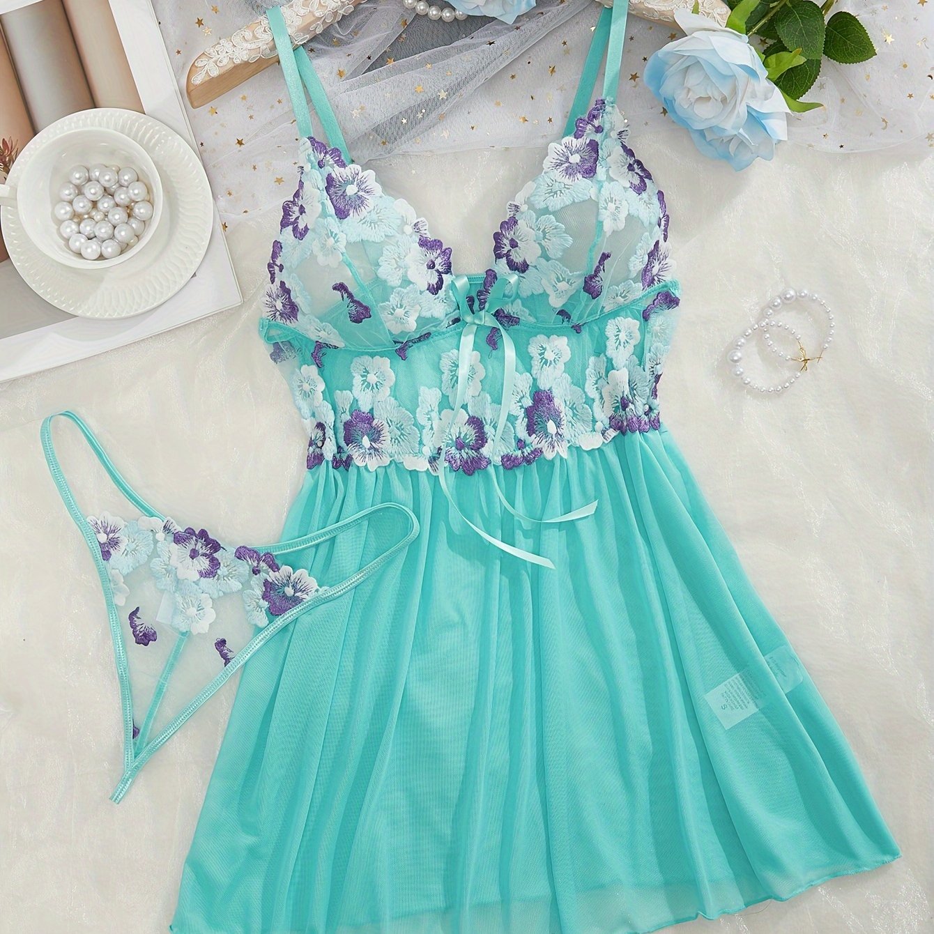 Women's sexy clothing set includes embroidered flower pattern babydoll, deep V slip dress, and thong.