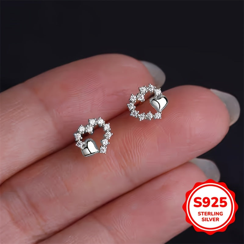 These graceful heart-shaped earrings are crafted from S925 silver with synthetic zirconia stones. Their simple and minimalist design is perfect for girls who prefer a cool and elegant style. These versatile earrings make a great gift for birthdays or