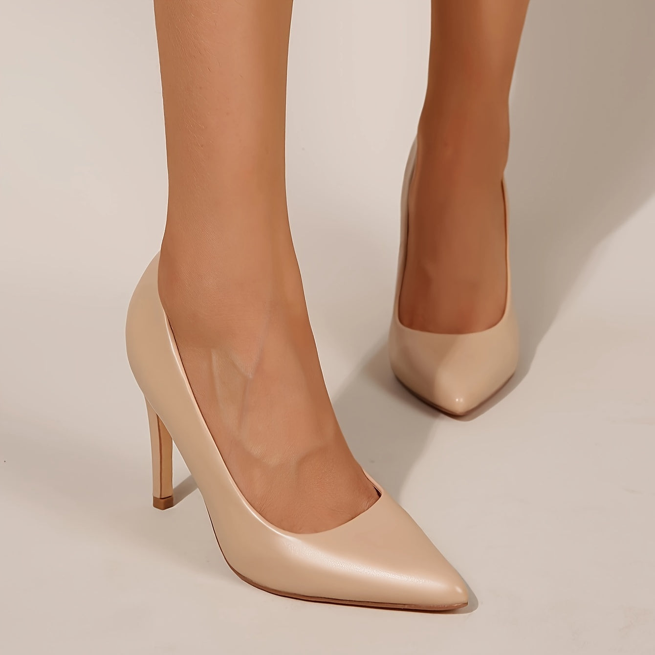 Elegant nude beige stiletto pumps for dressy occasions.