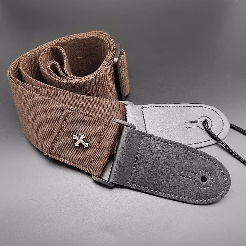 Vintage electric guitar strap with cross design and pick pocket, suitable for acoustic, folk, bass, and ukulele.