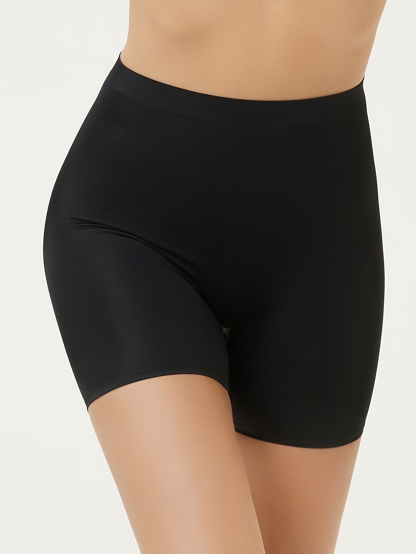 High waisted tummy control sports shorts for women that lift the butt and shape the body, made with breathable fabric.