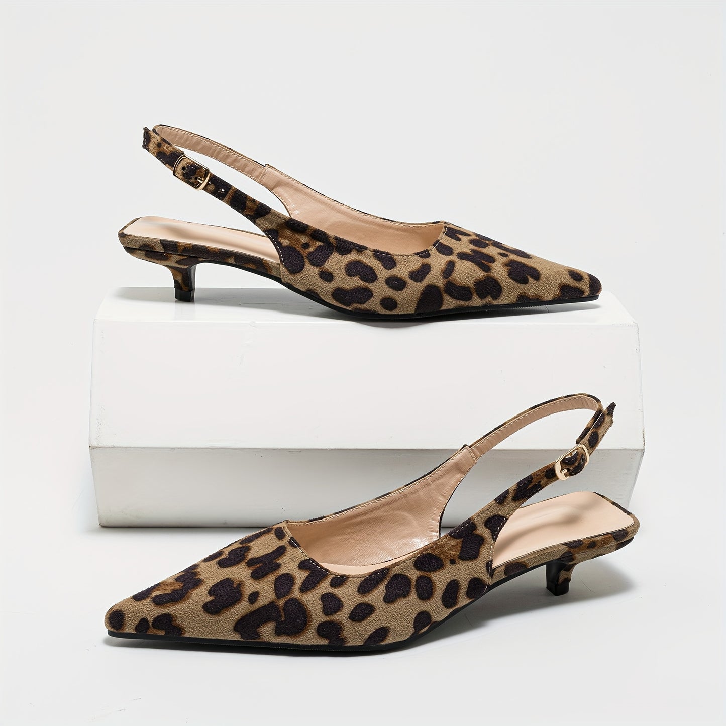 Leopard print pointed-toe mules with low chunky heel, perfect for casual or dressy outfits in summer.