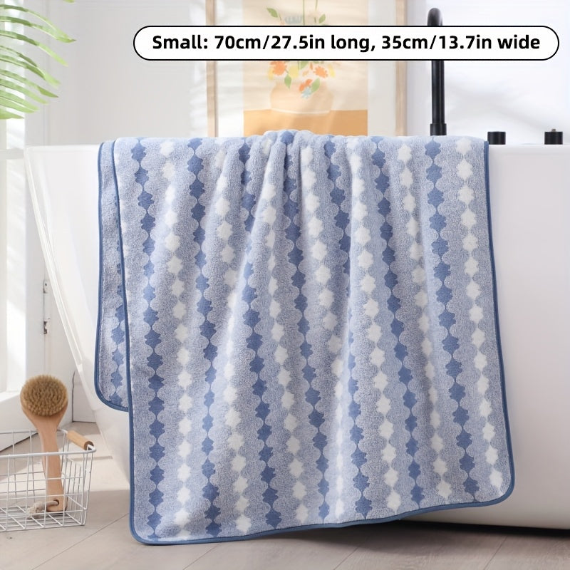 One set of extra large and small bath towels for women made of super soft, absorbent coral velvet with a modern design and strong absorbency.