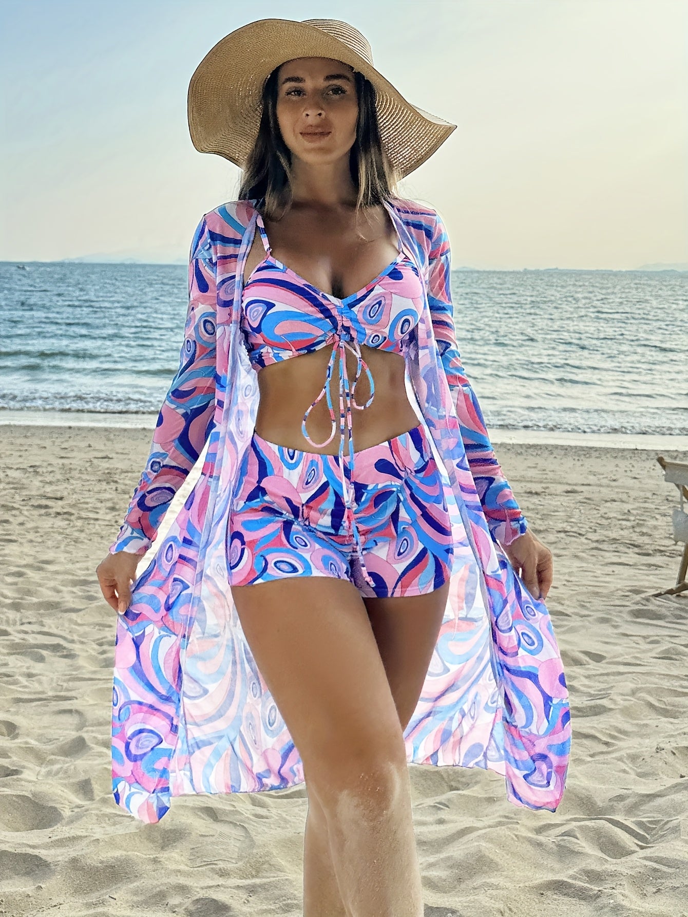 Stylish geometric bikini set for women with long sleeve cover-up - made from stretchy, non-see-through polyester blend that can be machine washed.