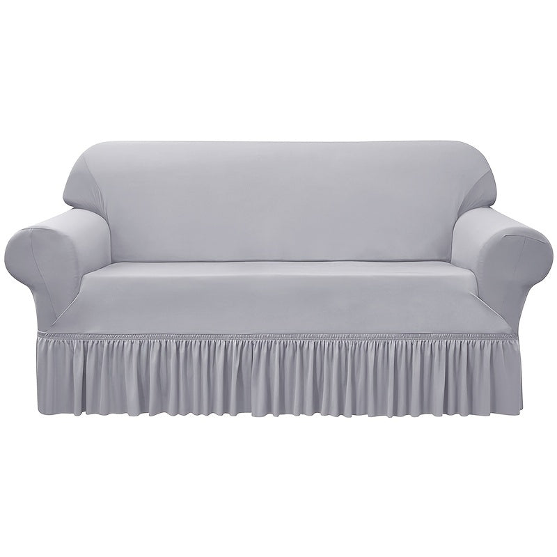 Elastic waterproof sofa slipcover with skirt for all seasons, ideal furniture protection for home and office.