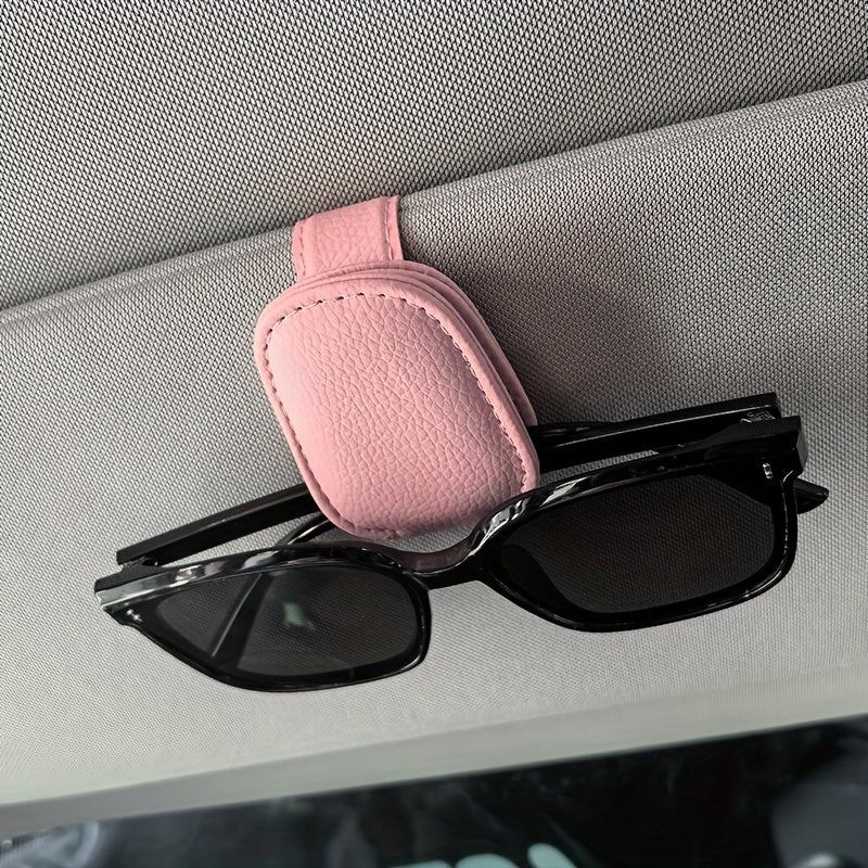 Universal car sun visor clip made of PVC material for storing eyeglasses in the vehicle interior.