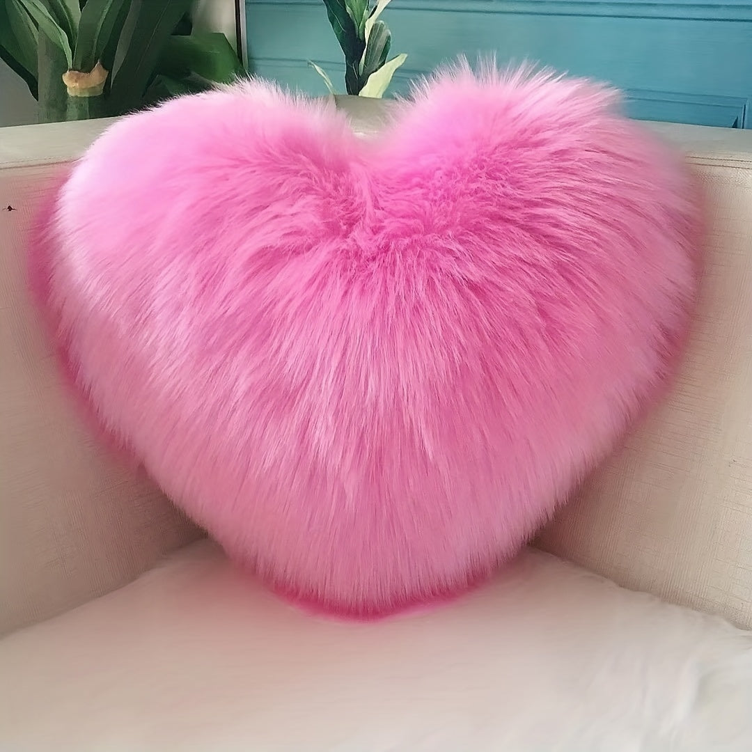 Heart-shaped throw pillow for living room or bedroom, made of long plush material for softness and comfort.