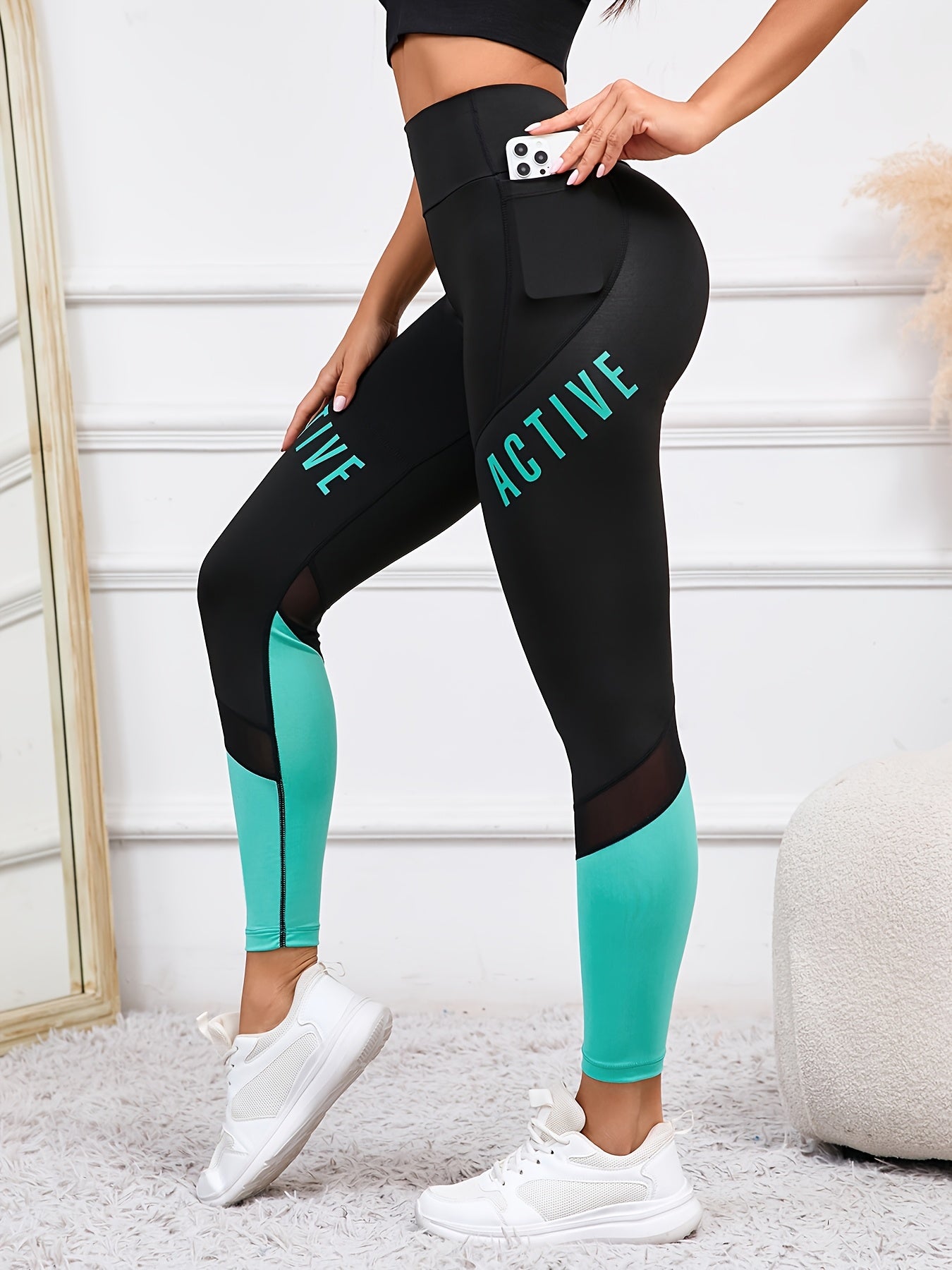 High waisted yoga leggings with pockets and color-block letter print for women's casual sports wear.