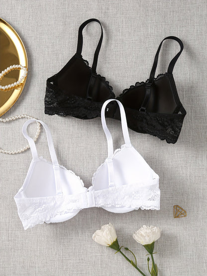 Set of 2 lace push-up bras for women in black and white, with underwire support and delicate lace detailing. Made of breathable nylon and elastane blend, non-see-through.