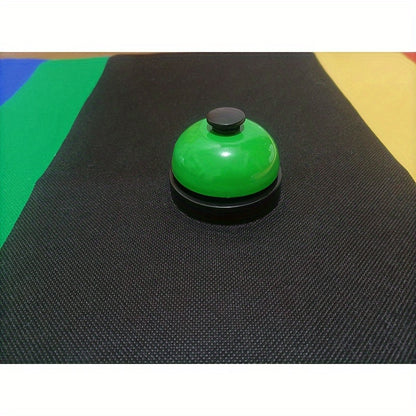 Colorful metal hand-press training bell for dogs & cats with red, yellow, & green bells on black background. Durable & easy-to-use pet trainer.