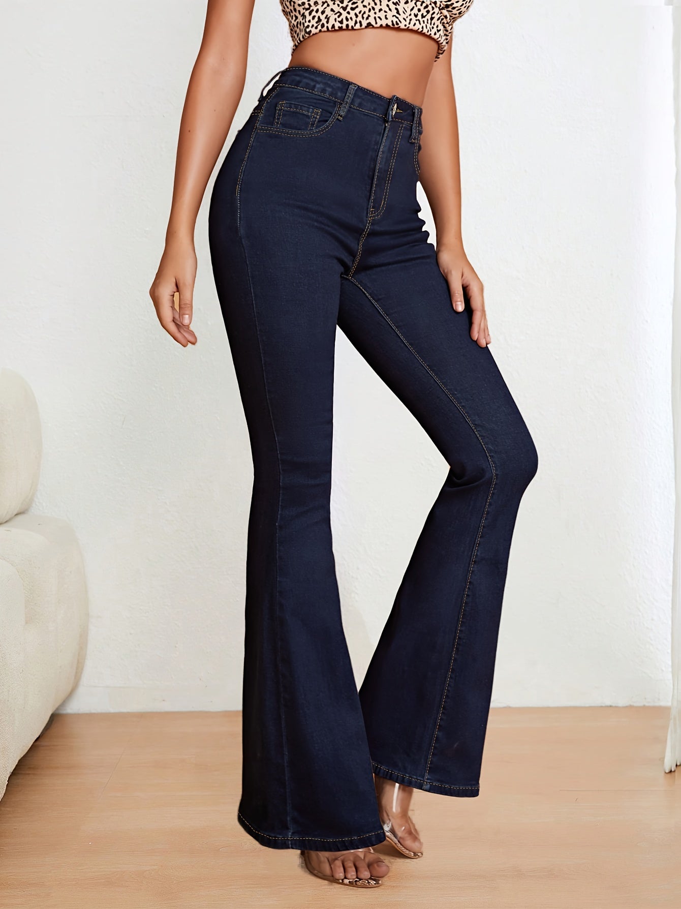 Blue stretch denim flare jeans for women, slim fit, high-waisted with button closure, machine washable.