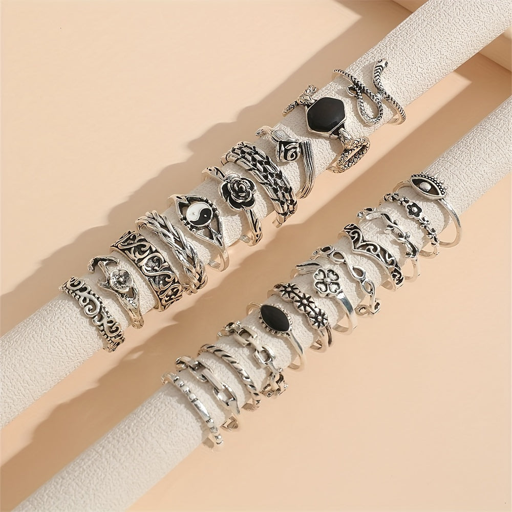 A collection of 22 vintage-inspired oil drop gossip snake eye rose carved joint rings suitable for both men and women.