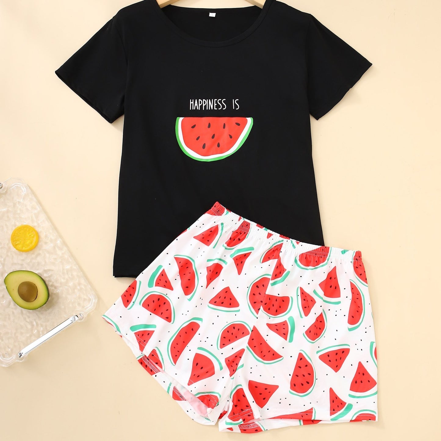 Women's loungewear set with watermelon and letter print, including short sleeve top and elastic shorts.