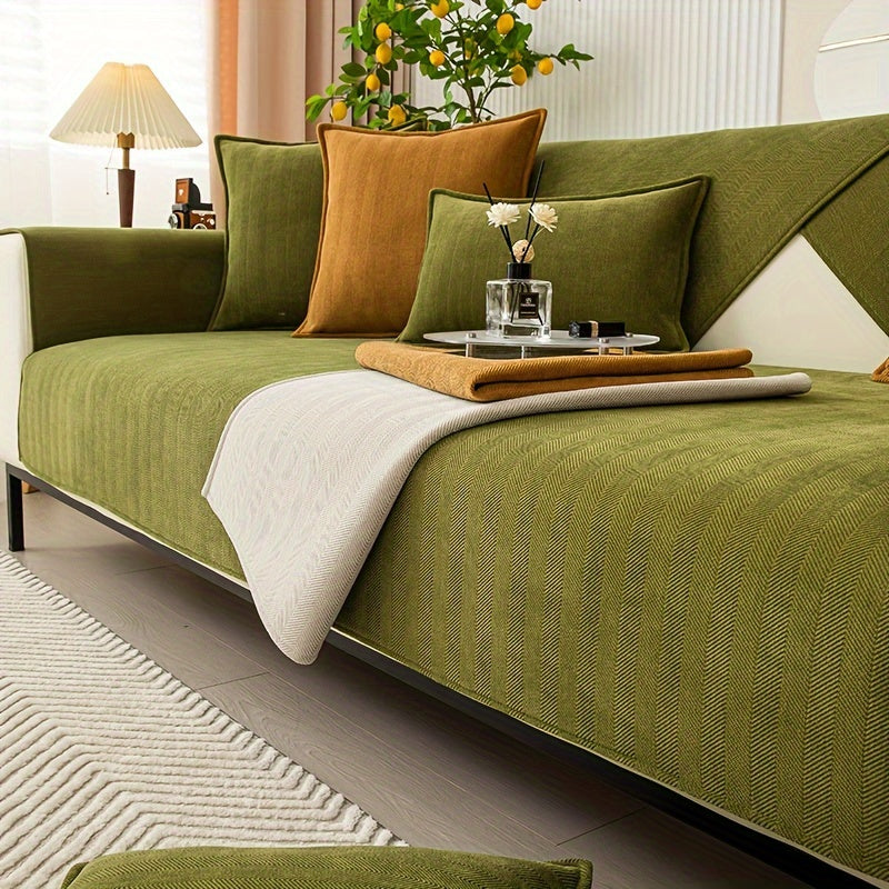 Green chenille sofa cover with herringbone pattern, non-slip and pet-friendly. Fits single to four-seater sofas. Machine washable polyester blend for sofa protection and enhancement. Ideal for living room, bedroom, or office decor.