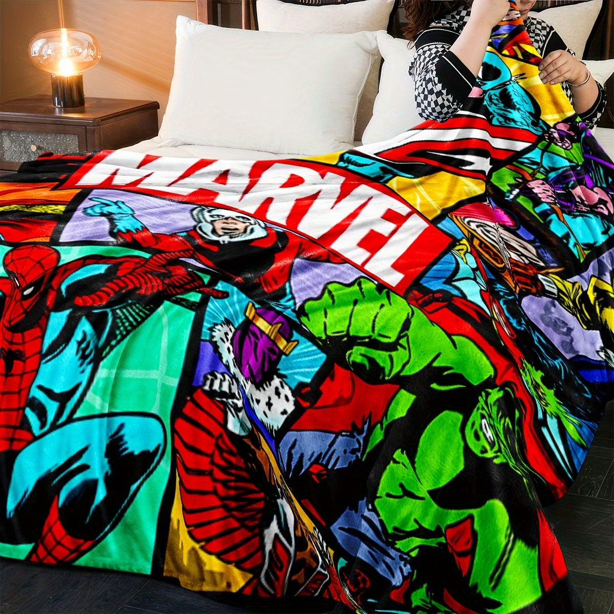 Cozy up with this Marvel Superhero Plush Throw Blanket featuring a vivid digital print. Made for all seasons, this knit bedding is perfect for the sofa, travel, camping, bedroom, and even the car. It's the ideal gift for your son.