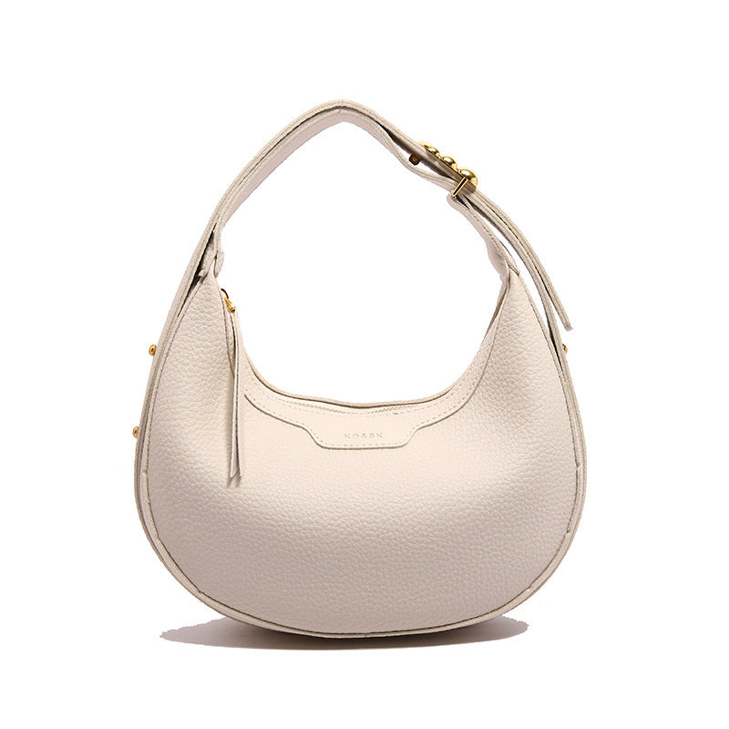 Trendy women's crescent moon crossbody bag with adjustable strap, golden-tone hardware, decorative stitching, and available in multiple colors.