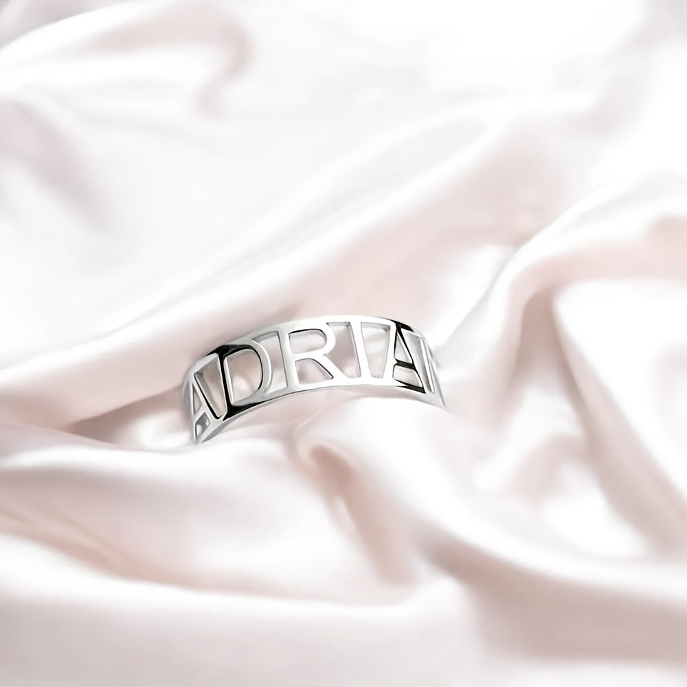 This elegant custom hollow ring features a chic and simple design, made from stainless steel. Perfect for a Valentine's Day gift or as a unique wedding band. Versatile enough for everyday wear, this classic ring is a timeless piece of jewelry.