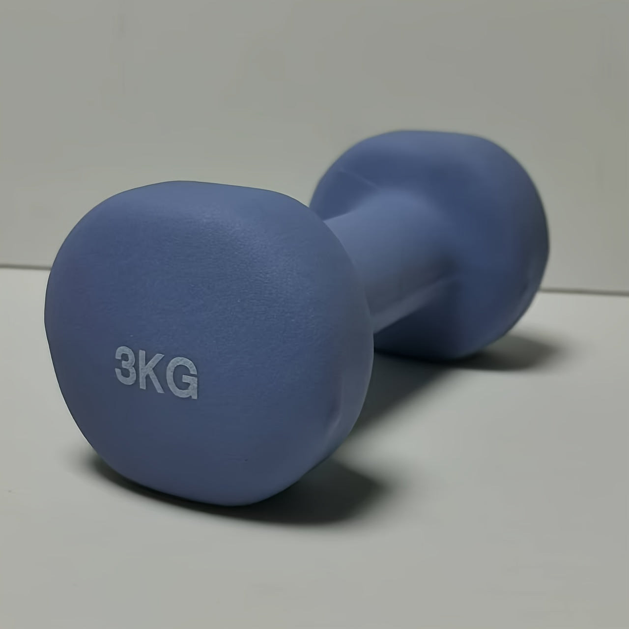 1pc 2kg dumbbell in pink/blue/black colors, made of solid cast iron for home gym. Durable and stylish fitness accessory for both men and women.