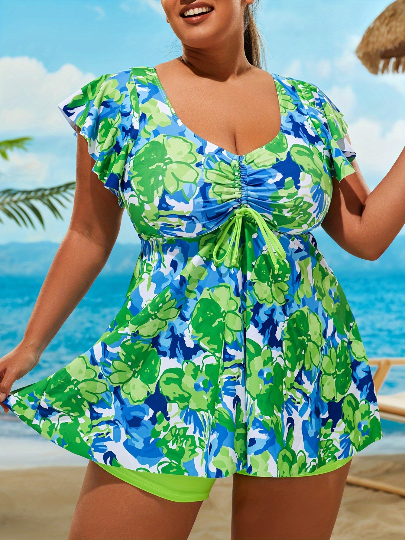 Floral print tankini set for plus-size women with drawstring front top and boxer short bottom.