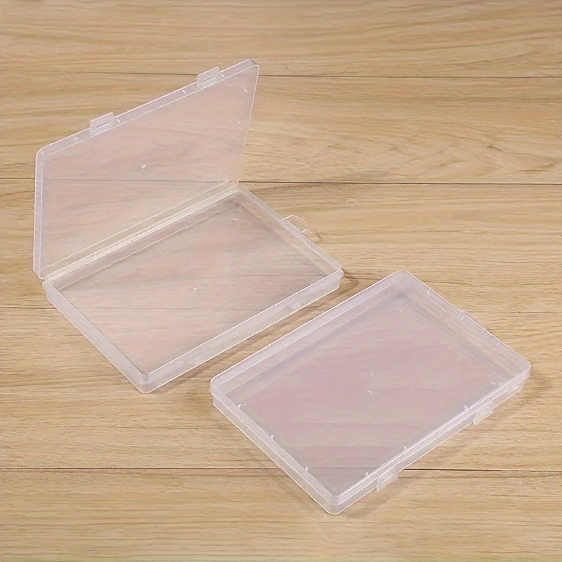 Rectangular plastic storage box with flip top lid, waterproof organizer for various items.