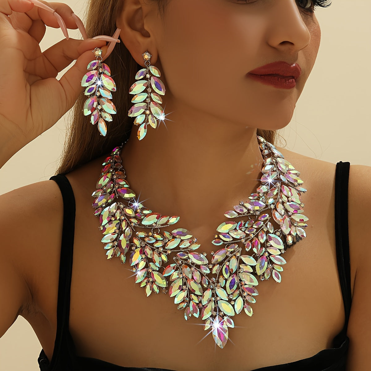 Luxurious wedding jewelry set crafted with fine materials and adorned with shimmering artificial crystals. This exquisite 3-piece set includes a necklace and earrings, perfect for weddings and special events. A timeless gift for any occasion, making it