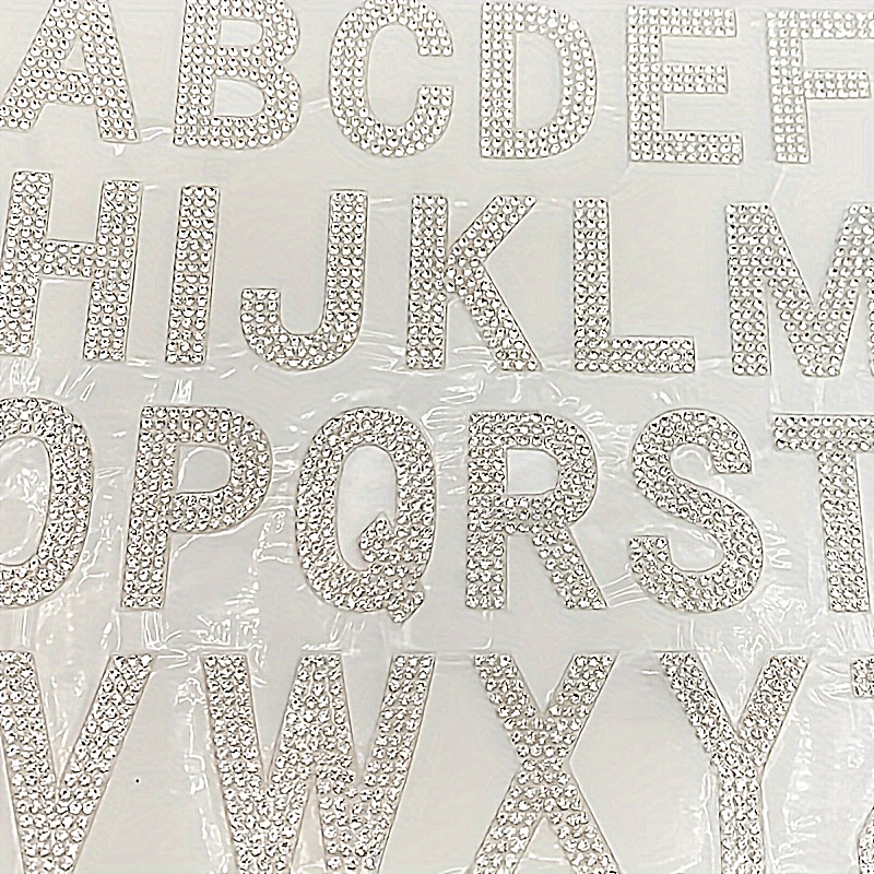 26 pieces of self-adhesive silvery rhinestone letters from A to Z, backed with iron and made of glass. Perfect for DIY projects on clothing, shoes, hats, car decorations, and other hobby crafting activities. Mix and match to personalize your items with a