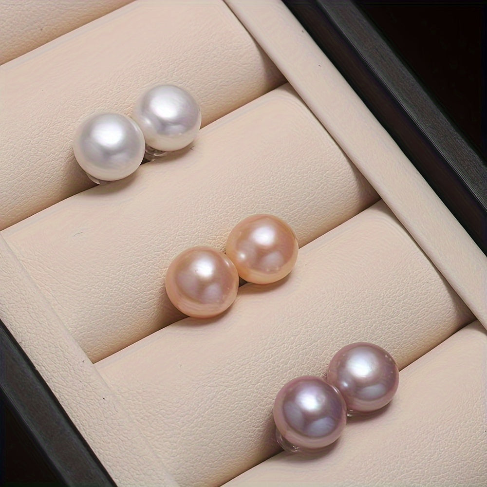 Set of 3 pairs of Saudade freshwater pearl earrings featuring natural round pearls in white, pink, and purple. The earrings are made of 925 sterling silver ear needles designed in a simple style for both daily wear and gift-giving occasions. These