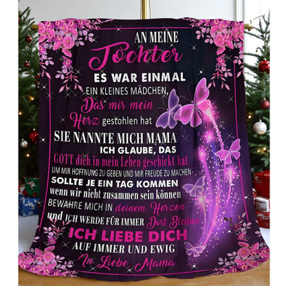 A contemporary soft flannel fleece blanket featuring a German message from Mom to Daughter, adorned with a beautiful purple butterfly and floral pattern. Suitable for all seasons with a digital print, made from 100% polyester and weighing 200-250gsm.