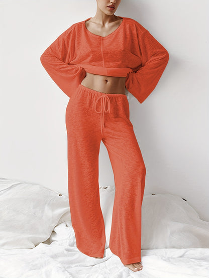 Women's two-piece set of loose and comfortable home clothes made with micro-permeable fabric, featuring round neck and long sleeves.