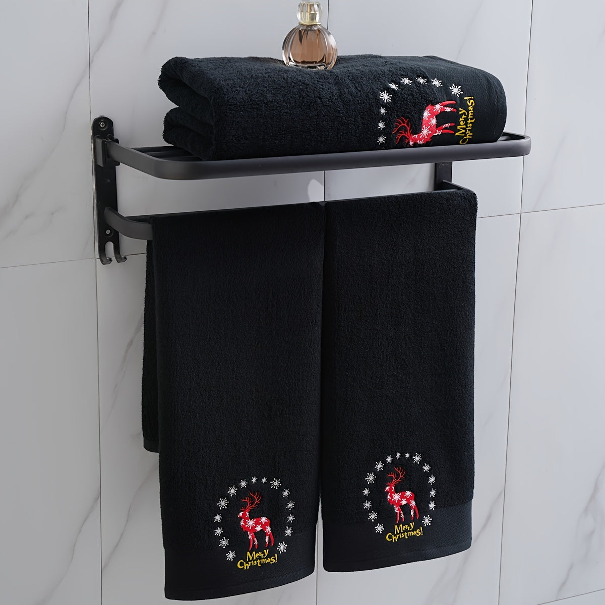 Christmas-themed towel set with embroidered snowman design. Includes 2 towels and 1 bath towel, ideal for couples' bathroom essentials and holiday gifts. Made of 100% cotton.