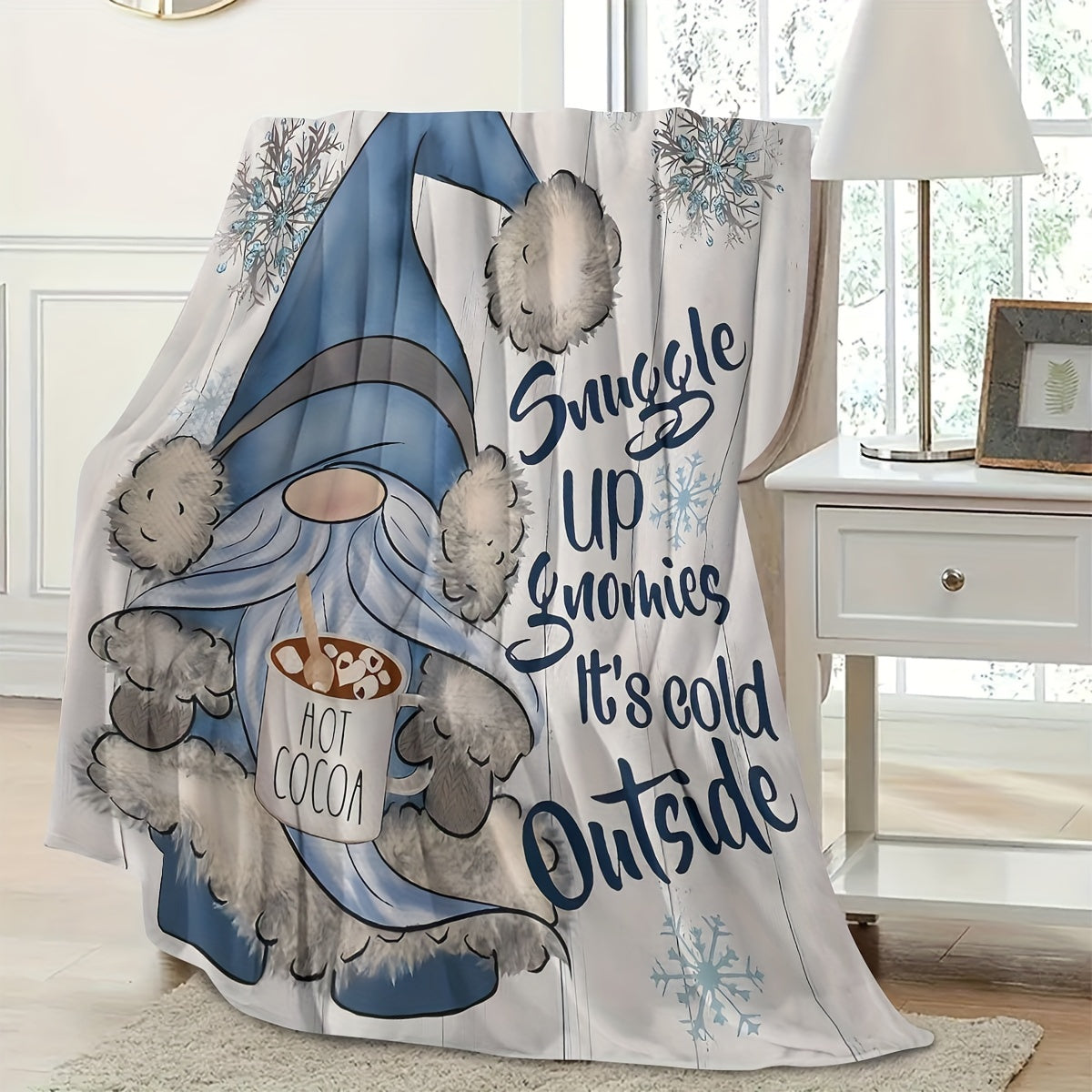 Soft and cozy Rustic Blue Gnome Throw Blanket made of flannel fleece with a fantasy print design. This all-season blanket is machine washable and features a digital print on a polyester cover with a polyester lining. Perfect for home and kitchen decor