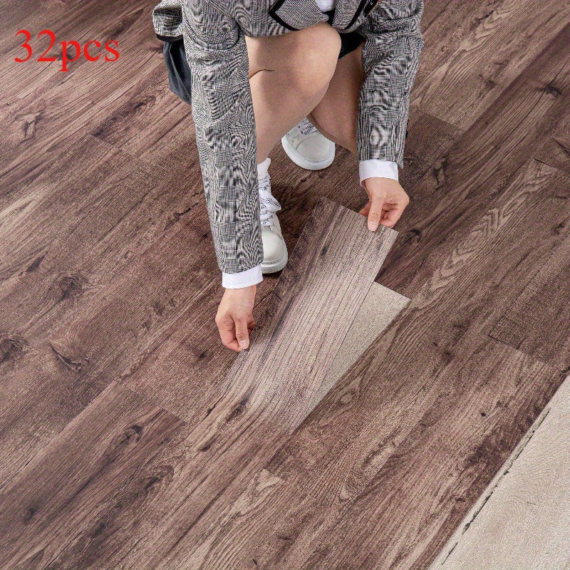 32 peel and paste floor tiles with wood grain design, 45cmx15cm, self-adhesive, waterproof, suitable for bedroom and home decor.