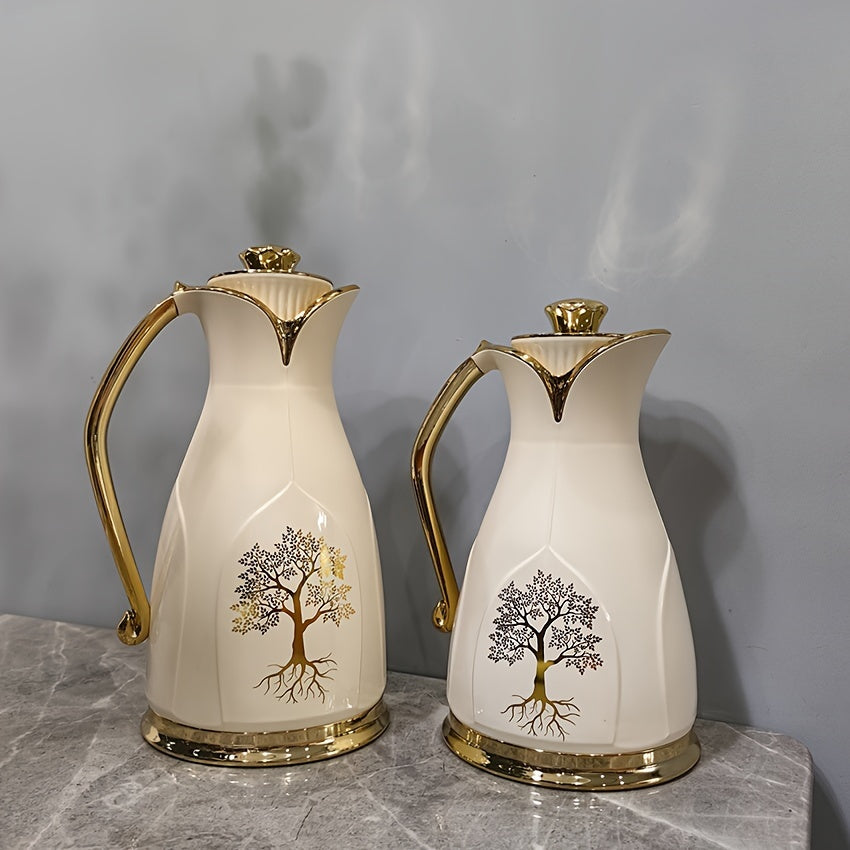 Two Vacuum Insulated Thermal Carafes for Coffee and Tea - Stainless Steel Double-Wall Flasks in 1L and 0.7L sizes, featuring an elegant Golden Tree Design. Keeps beverages hot without the need for electricity.