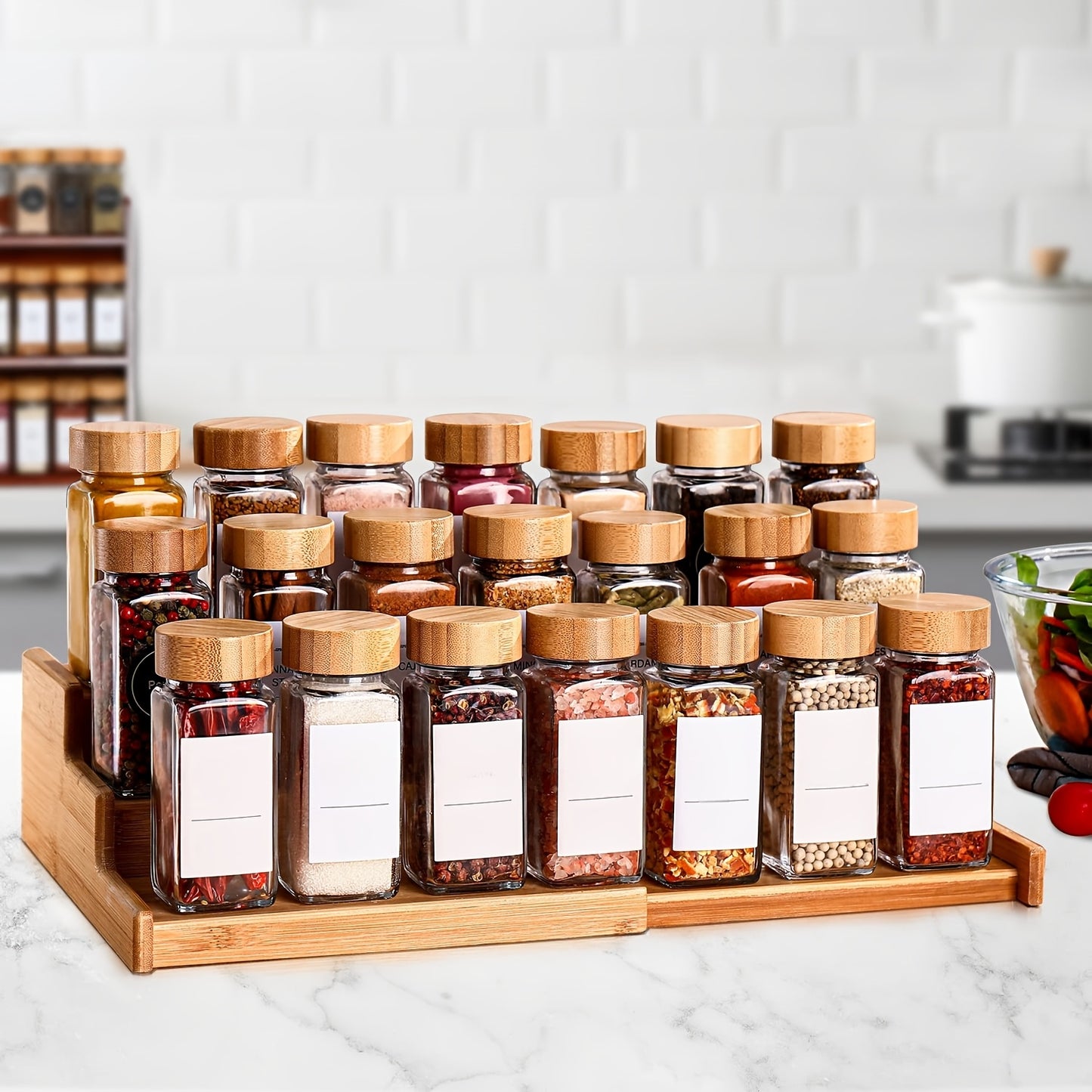 12-piece glass spice jar set with bamboo lids, labels, and funnel for airtight kitchen storage of seasonings and condiments.