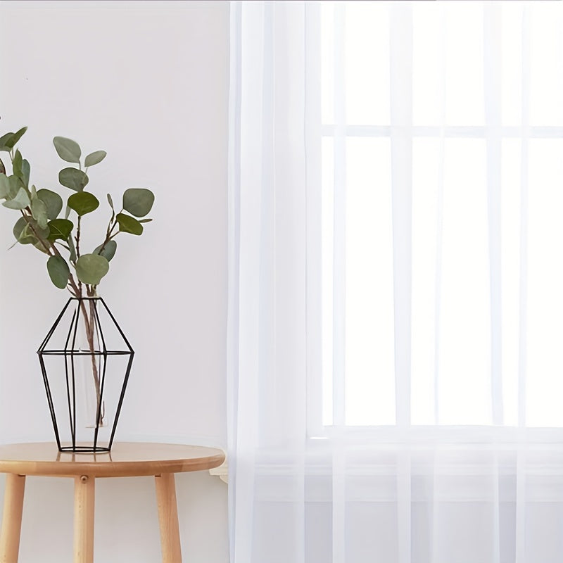 Enhance your decor with these elegant sheer voile curtain panels. Made of semi-transparent polyester, they feature a rod pocket design for easy hanging in your kitchen, bedroom, or living room. Create a romantic ambiance with these beautiful curtains.