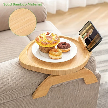 Non-slip sofa tray with phone holder and foldable armrest table, ideal for wide sofas and includes a drink holder shelf. Made of wood.