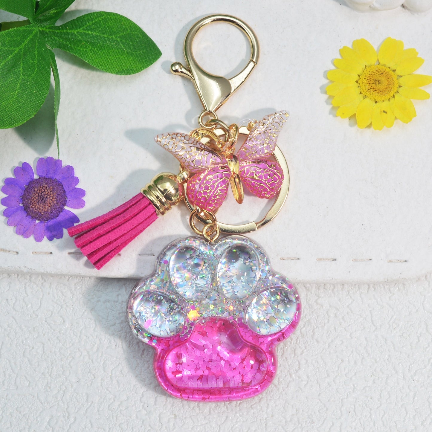 Butterfly tassel ladies bag keychain pendant in the shape of a cat's paw, perfect as a birthday or holiday gift for a creative animal lover.