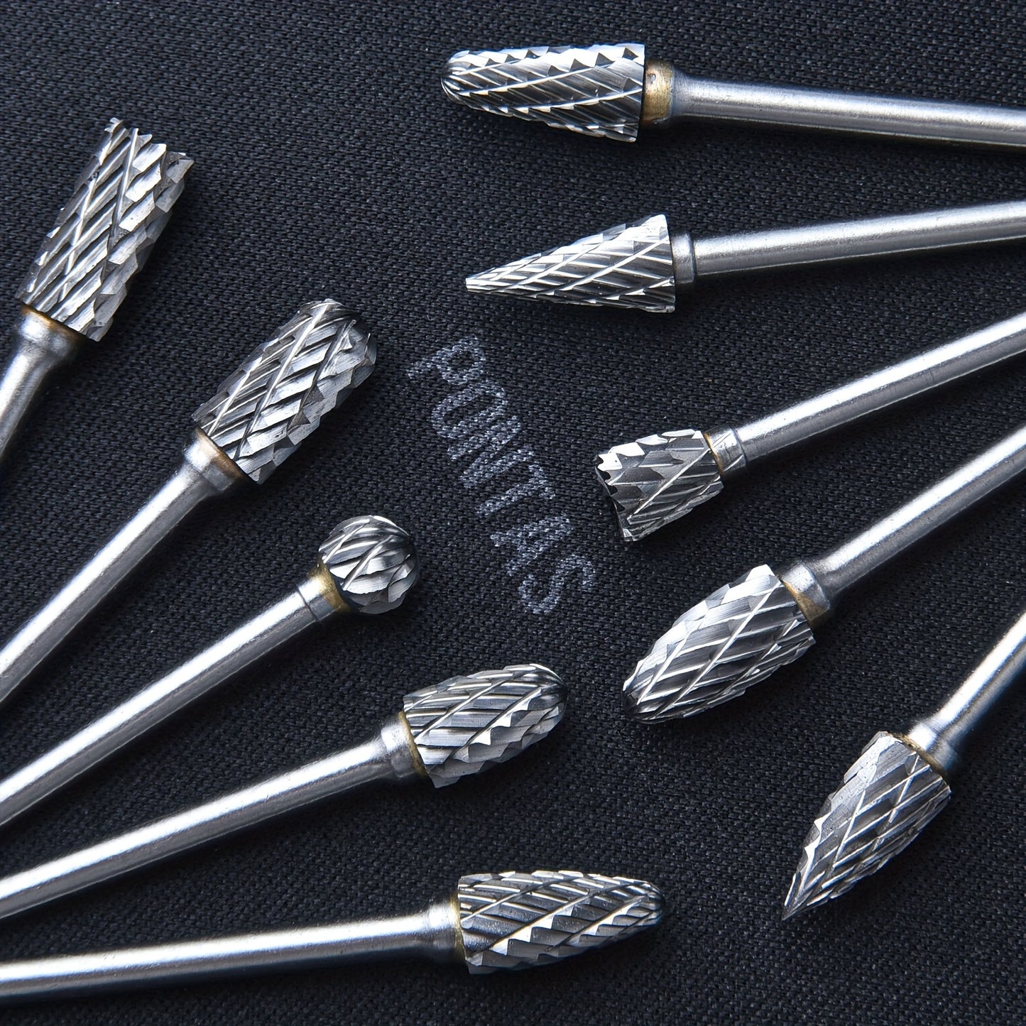 10-piece set of high-performance tungsten carbide rotary burrs with 1/8" shank for precise grinding and carving. Double cut for efficiency.